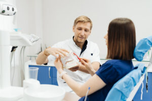 dentist showing the correct dental hygiene on whit 2022 02 01 22 37 27 utc 1
